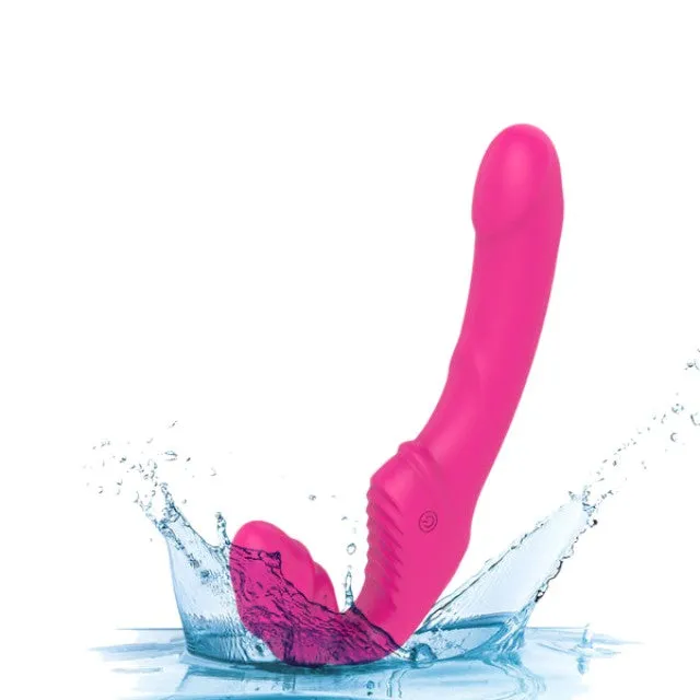 Vibrator dublu TOYZ4LOVERS Elys Love Gun. strap-on fără ham. control prin telecomandă. cu vibrații multiple. 21.8 cm. roz