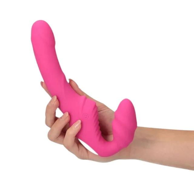 Vibrator dublu TOYZ4LOVERS Elys Love Gun. strap-on fără ham. control prin telecomandă. cu vibrații multiple. 21.8 cm. roz